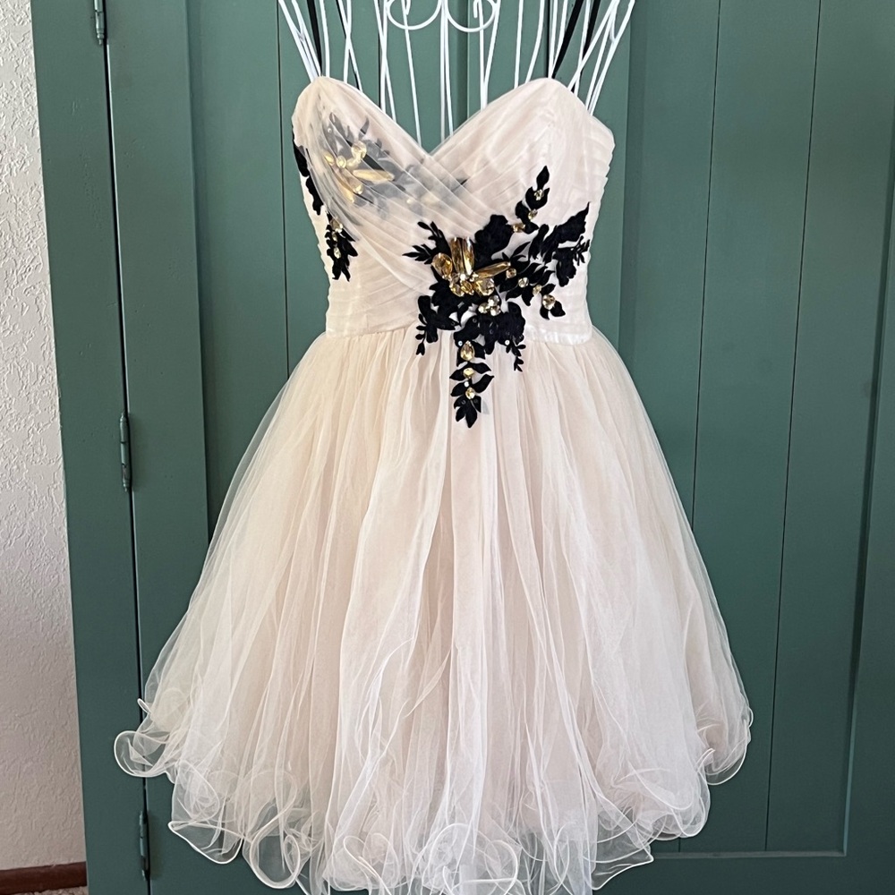 Elegant Strapless Dress with Black Floral Accents